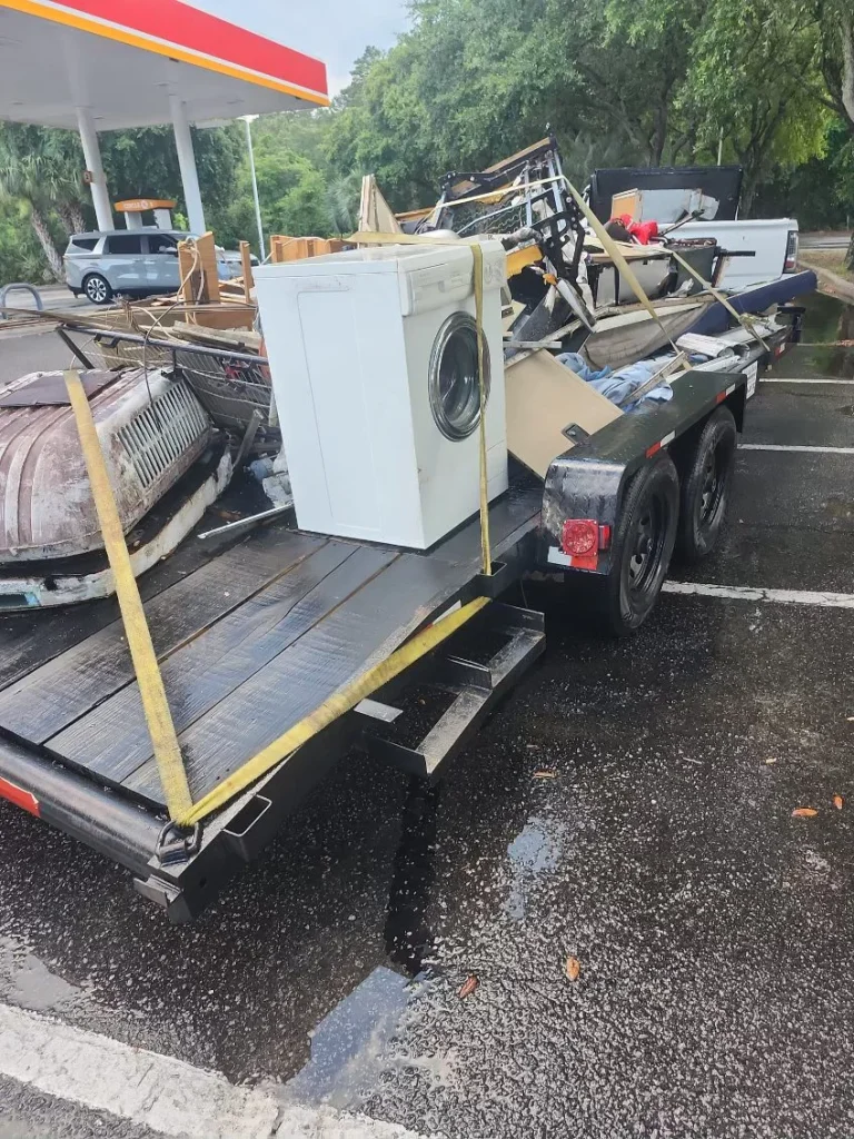 Truck transporting junk as part of comprehensive junk removal service.